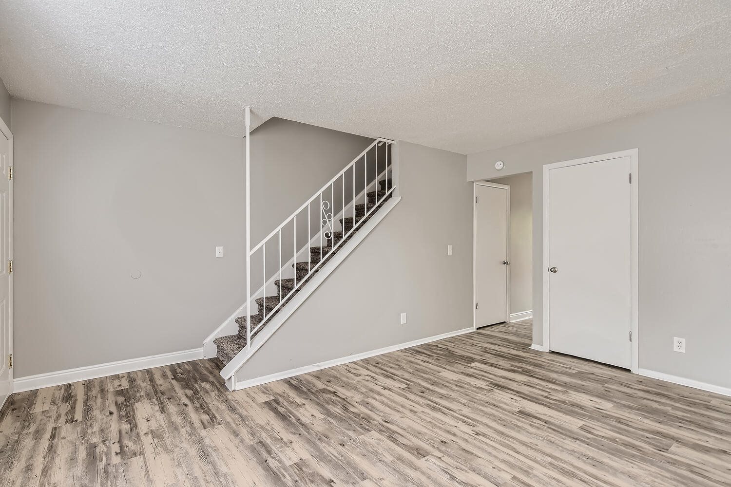 Alder Square Living Room with stairs Alder Square Living Room with stairs